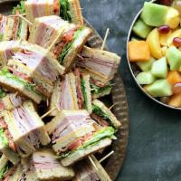Party Platter Stacked-To-The-Max Club · (24 sandwich quarters) Sliced ham & turkey, crisp smoked bacon, Swiss & cheddar with lettuce...