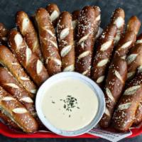 Party Platter Pretzel Sticks · 25 warm house-baked pretzels, with white cheddar queso.