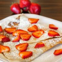 Strawberry Nutella Crepe · Classic Nutella crepe with strawberries, bananas, powder sugar, and a drizzle of chocolate s...