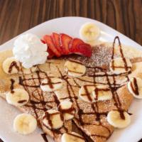 Strawberry Banana Crepe  · Classic Nutella crepe with strawberries, bananas, powder sugar, and a drizzle of chocolate s...