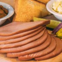 Bologna Dinner · Includes our slow-smoked bologna, 2 of our delicious sides, pickle, pepper, onion & our famo...