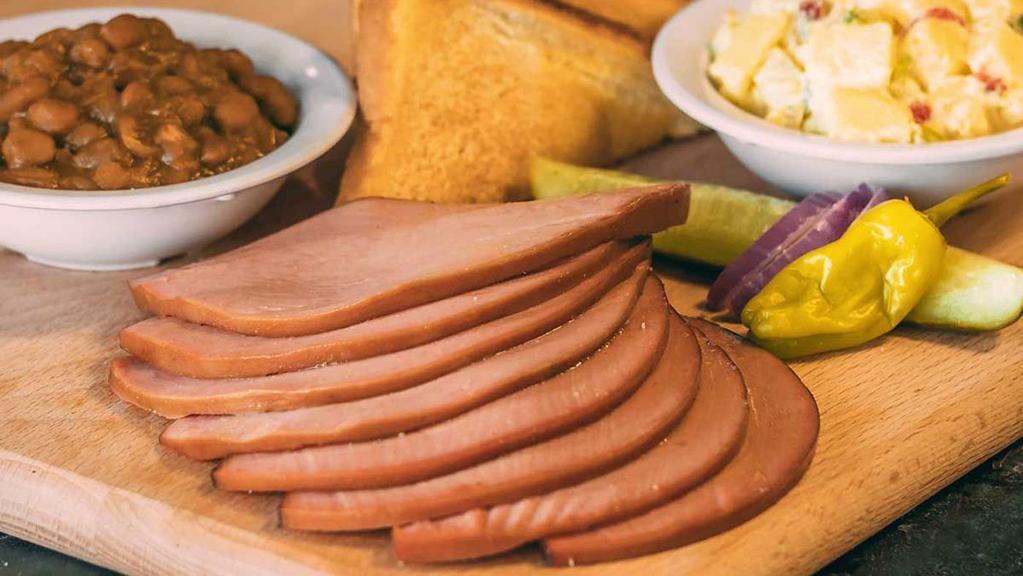 Bologna Dinner · Includes our slow-smoked bologna, 2 of our delicious sides, pickle, pepper, onion & our famous BBQ sauce.