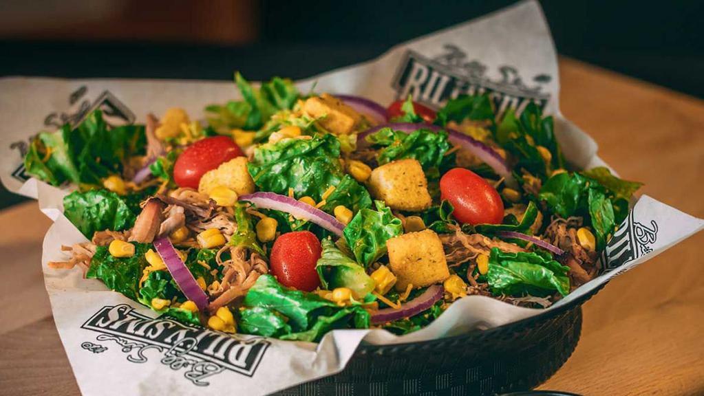 Schooner Salad · A fan favorite, our Schooner Salad includes fresh romaine lettuce, cheddar cheese, smoked corn, onion, croutons, cherry tomatoes, & choice of meat. Served with our signature BBQ ranch dressing.