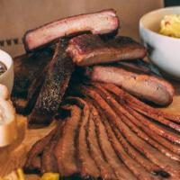 Rib Zone Family Pack · Full rack of ribs, plus 1 pound of meat, 2 sides ( 1 pint each), & 4 slices of Texas toast  ...
