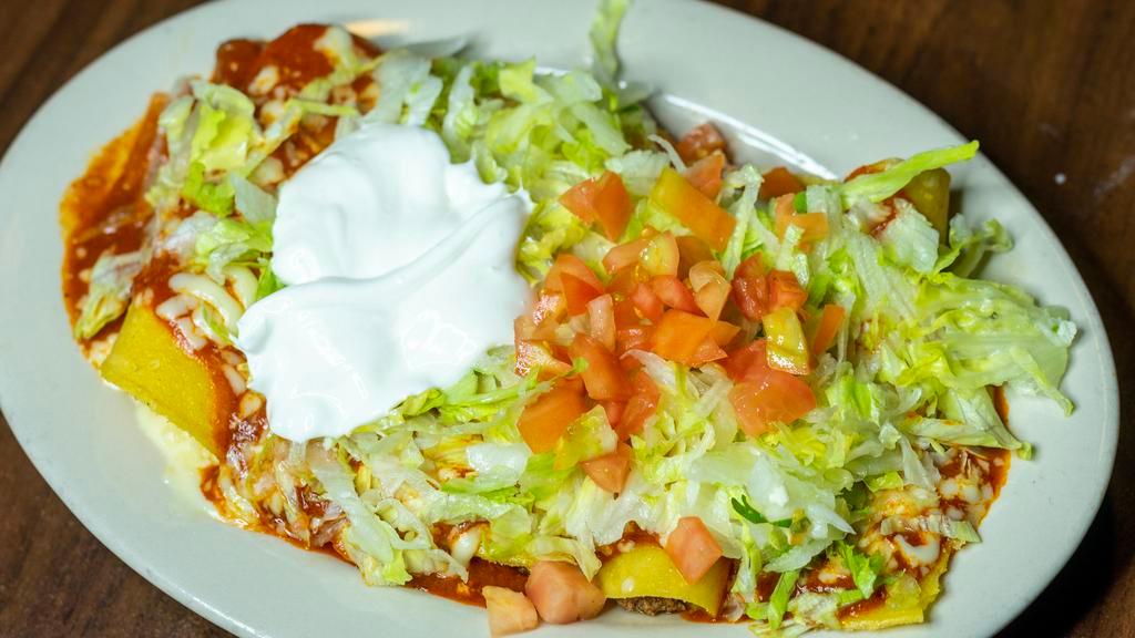 Enchiladas Super Rancheras · Five different enchiladas, one each of beef, chicken, shredded beef, beans and cheese, topped with ranchera sauce and cheese. Served with lettuce, tomatoes and sour cream.