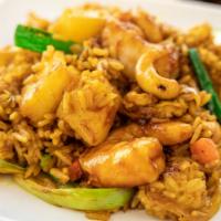 Pineapple Fried Rice · Thai style fried rice with eggs, onions, peas, carrots, pineapple and cashews.