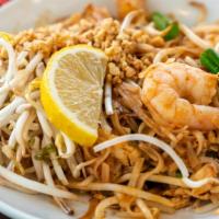 Pad Thai · Sautéed rice noodles with bean sprouts, eggs and green onions. Topped with lemon and crushed...