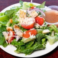 House Salad · Crisp romaine lettuce topped with onions, tomatoes, parmesan cheese, and croutons.
