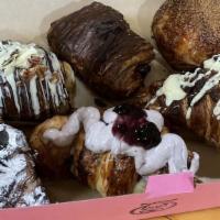 Box Of 6 Different Pastries · Box of 6 different mix pastries that might include but might differ: Nutella, peach and chee...