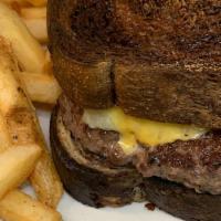 Patty Melt · 1/2 lb burger, garlic, fried onions, mushrooms, American and Swiss cheese.