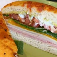 El Meson Sandwich · Focaccia bread, ham, turkey, pepper jack cheese, cheddar cheese, spinach, tomato, red onion,...