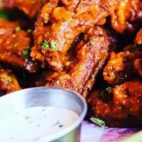 Wings · Tossed in your choice of: Buffalo, Honey Sriracha, Honey Mustard, Valentina Lime, Memphis Dr...