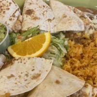 Quesadilla De Camarones · Flavorful shrimp and cheese. Served with Spanish rice, refried beans, and guacamole.