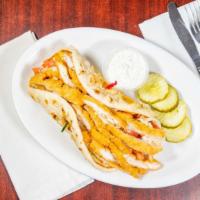Chicken Gyro Dinner · With tomatoes, onions, and gyro sauce.