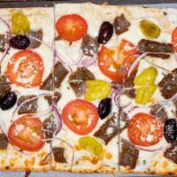 Greek Flatbread · Tzatziki sauce, gyros meat, tomato, onion, kalamata olives, feta and mozzarella cheese on la...