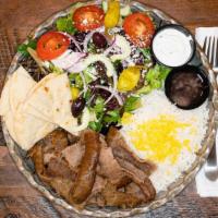Gyros Platter · 1/2 lb. Of gyros, small greek salad and rice or fries.