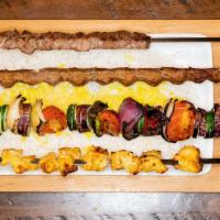 Kabob Rack · Beef and lamb, chicken, tenderloin and veggie kabobs with rice. Serves up to 4 people