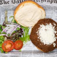 Falafel Burger · Feta, tzatziki, and hummus on a bun.