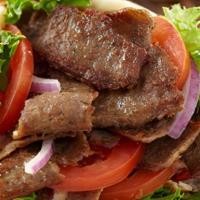 Gyro Sandwich · Slowly cooked beef and lamb sliced on pita bread with onions, tomato and our homemade cucumb...