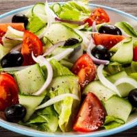 Greek Salad · Includes lettuce, cucumber, tomatoes, onions, Kalamata olives and feta cheese with our homem...