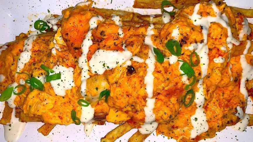 Loaded Buffalo Fries · Home cut fries topped with our signature buffalo chicken, cheese, homemade ranch and green onions.