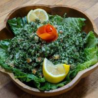 Tabouli · Chopped parsley, tomatoes, onions, lemon juice, olive oil and cracked wheat.