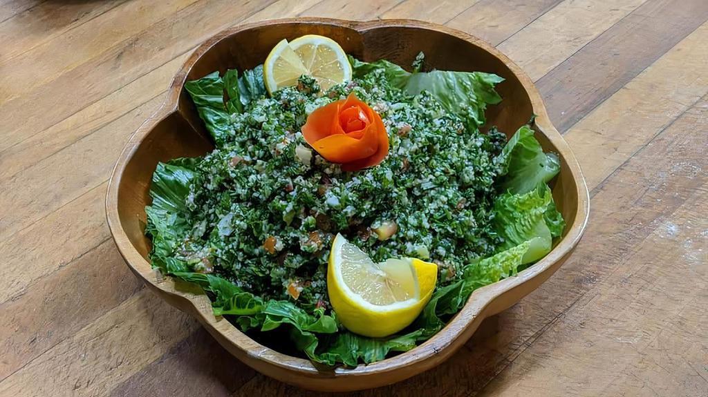 Tabouli · Chopped parsley, tomatoes, onions, lemon juice, olive oil and cracked wheat.