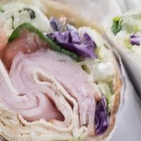 Smoked Turkey Pita · Provolone cheese, lettuce, tomatoes, and onions served in a pita with our special dressing.