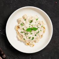 Alfredo Pasta (Fettuccine) · Fettuccine pasta cooked al dente tossed in creamy white sauce topped aged parmesan. Served w...