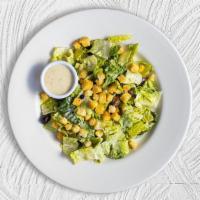 Classic Caesar Goodness · Crisp romaine lettuce, parmesan cheese and crunchy croutons. Served with caesar dressing on ...