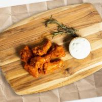 The Wing · Classic bone-in wings oven- baked, cooked to order perfectly crisp, and tossed with your cho...