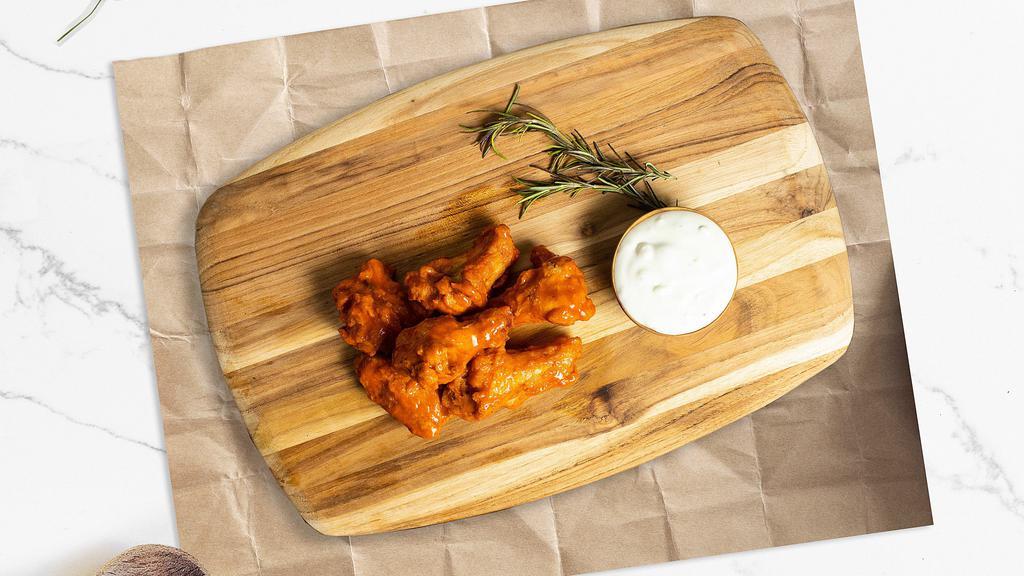 The Wing · Classic bone-in wings oven- baked, cooked to order perfectly crisp, and tossed with your choice of delicious sauces.