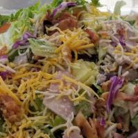 Big Time House Salad · Ham, bacon, tomato, onion, cucumber, egg,  shredded blend of cheese, tossed in a poppy seed ...