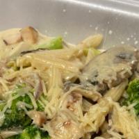 Chicken Alfredo · Penne pasta with chicken, onions, mushrooms and broccoli in cream sauce.