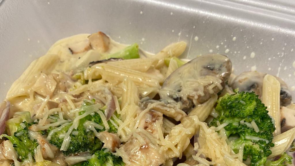 Chicken Alfredo · Penne pasta with chicken, onions, mushrooms and broccoli in cream sauce.