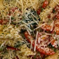Cajun Shrimp Pasta · Pasta with shrimp, spinach, peppers, onions, tomato and parmesan in a Cajun garlic butter sa...