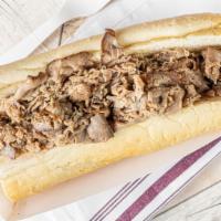 Italian Beef - 12 Inch · Slow-roasted, Italian -seasoned and very thin sliced beef served on fresh-baked Turano frenc...