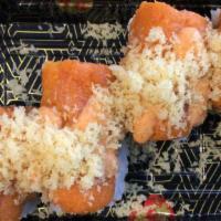 Spicy Girl (8) · Raw fish. Spicy tuna inside and topped with spicy salmon and crunch.