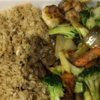 Hibachi Steak & Chicken · Served with broccoli zucchini onion mushroom and fried rice or white rice.
