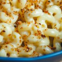 Mac And Cheese Curds · Cheddar and blue cheese mornay sauce, Cavatappi pasta, fresh cheese curds, garlic bread crumbs