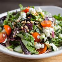 Wicker Park Salad · Romaine, red leaf lettuce, pine nuts, goat cheese, grape tomatoes and cucumbers with a roast...