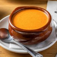 Creamy Tomato Soup · Scratch-made tomato soup topped with garlic croutons