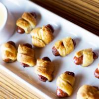 Pigs In A Blanket · Pastry dough, smoked sausage, beer cheese.
