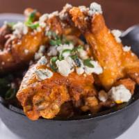 Wings · Bleu cheese, celery, carrots. Sauces: hot or chipotle BBQ