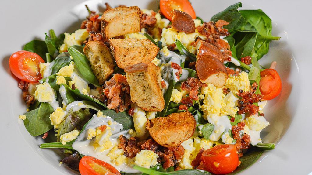 House Salad · Gluten free available. Mixed greens, egg, bacon, cherry tomatoes pretzel croutons.