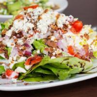 Wedge Salad · Gluten free. Butter lettuce, bleu cheese crumbles, bacon red onion cherry tomatoes, balsamic...