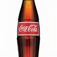 Mexican Coca-Cola · Coca-Cola in a glass bottle.  Made with real sugar.  Imported from Mexico.