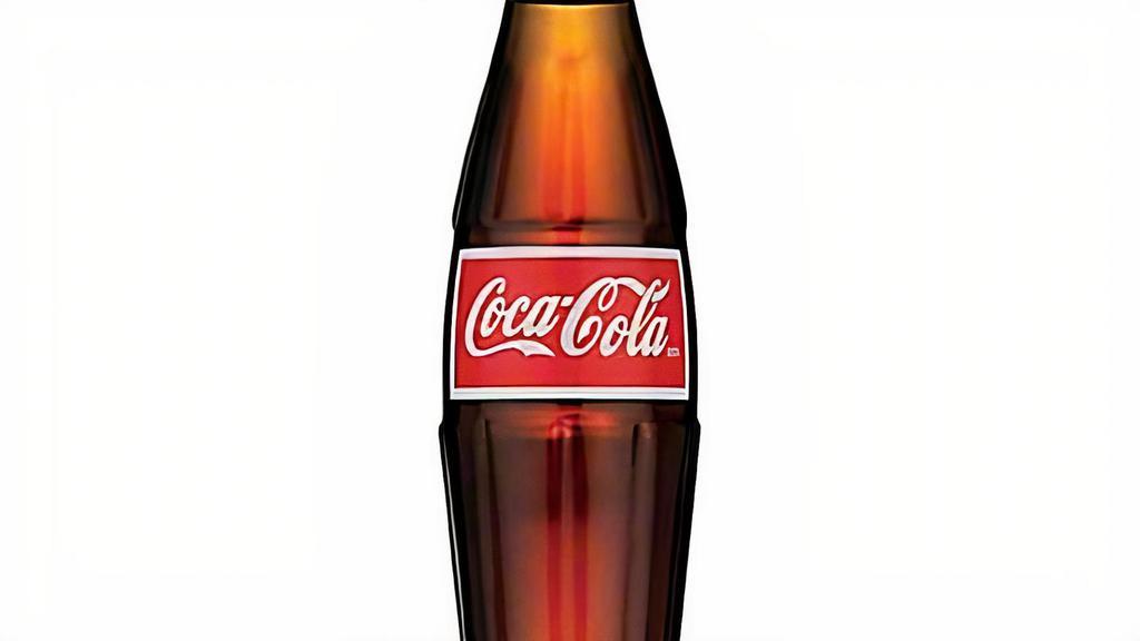 Mexican Coca-Cola · Coca-Cola in a glass bottle.  Made with real sugar.  Imported from Mexico.