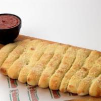 Guido Bread · Try our golden brown baked bread sticks. Topped with melted Butter, Parmesan Cheese & Garlic...