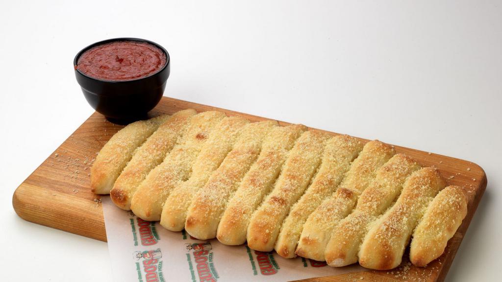 Guido Bread · Try our golden brown baked bread sticks. Topped with melted Butter, Parmesan Cheese & Garlic. With choice of one of our Savory Sauces!